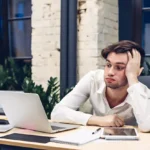 tired businessman working laptop computer table office 136930 704