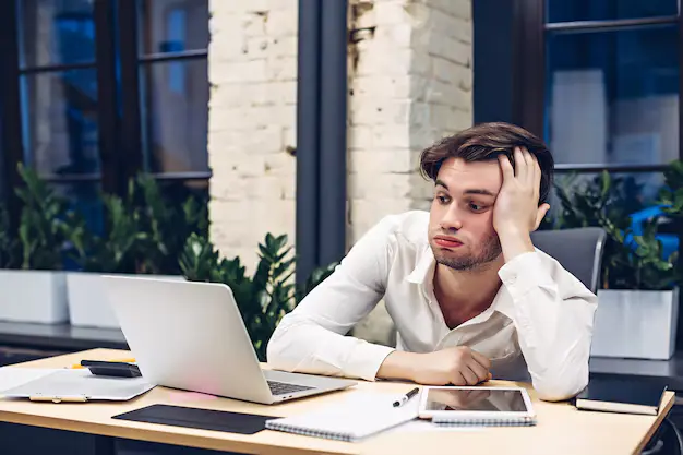 tired businessman working laptop computer table office 136930 704